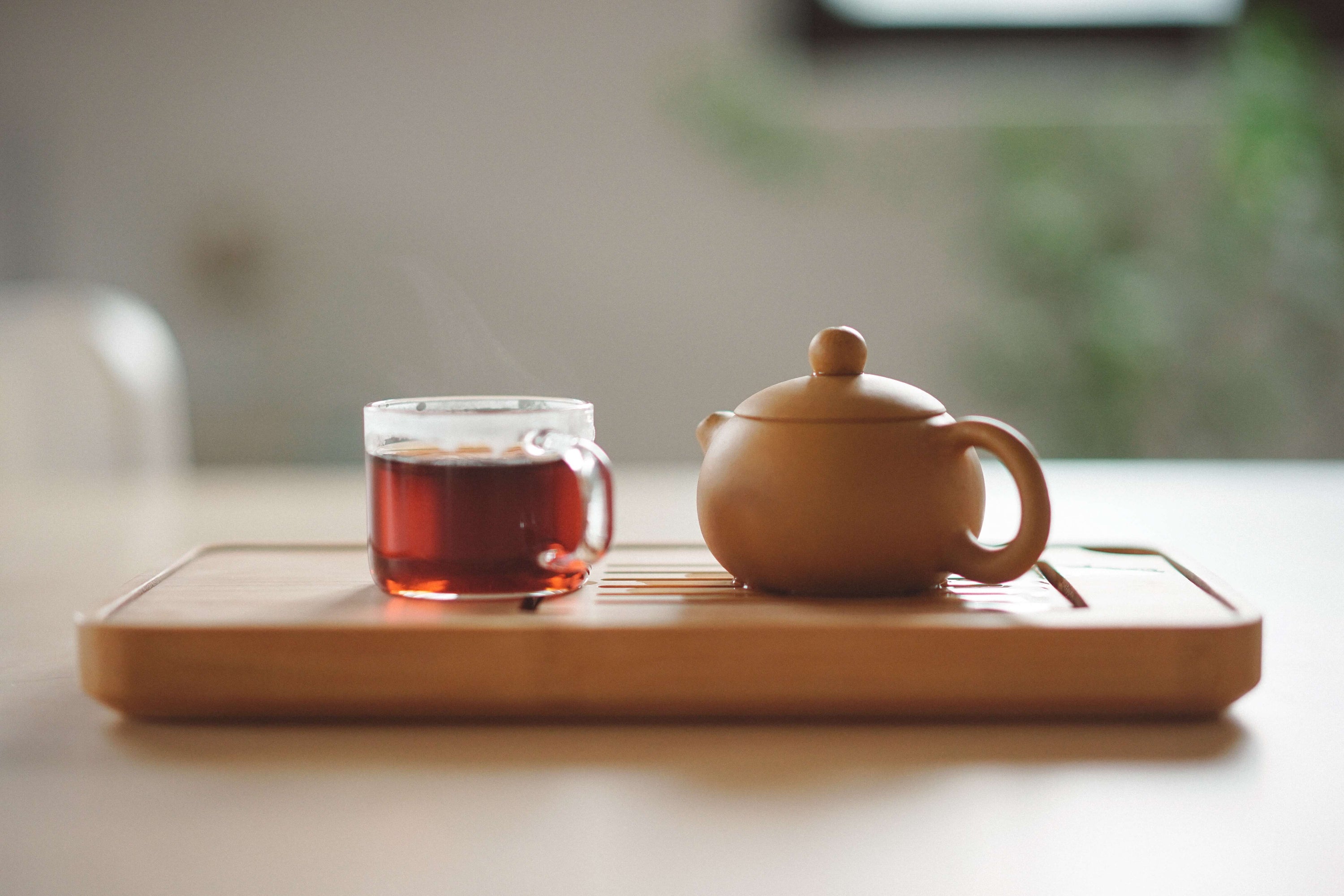brown tea pot with tea cup